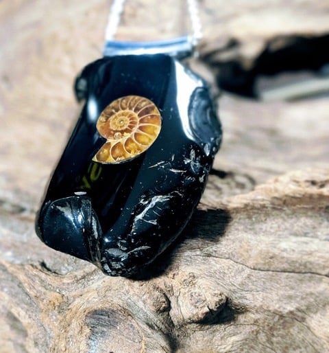 Inlaid Whitby Jet pendantt set with ammonite fossil.