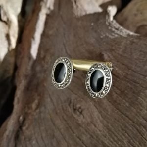 Whitby Jet Stud earrings set in a decorative sterling silver surround.