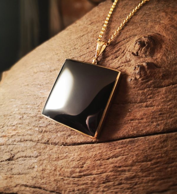 Large gold and Whitby Jet pendant.