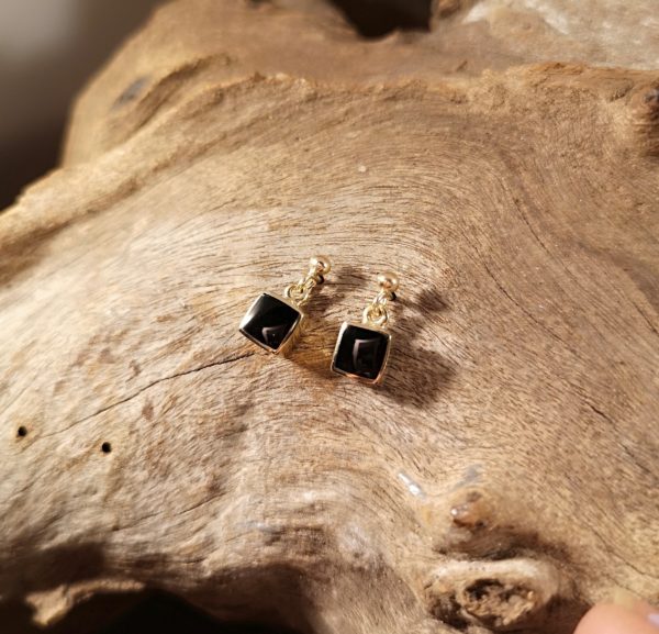 Gold and Whitby Jet drop earrings.