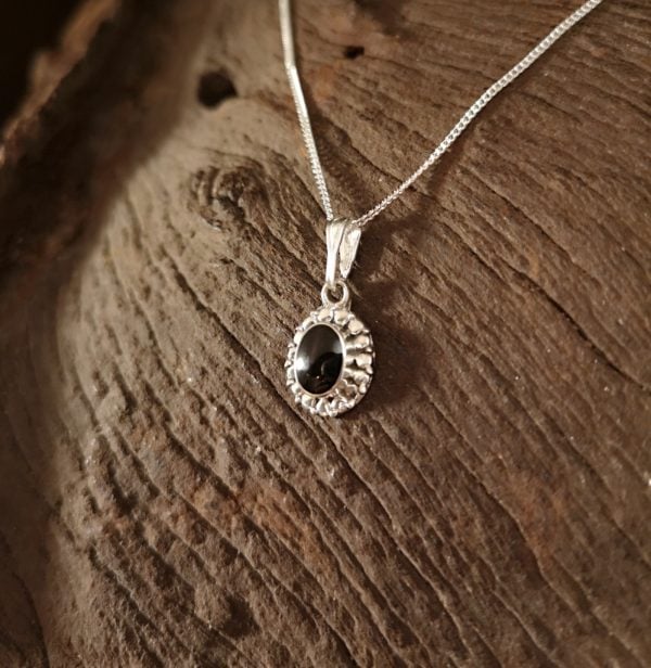 Sterling silver and Whitby Jet oval pendant.