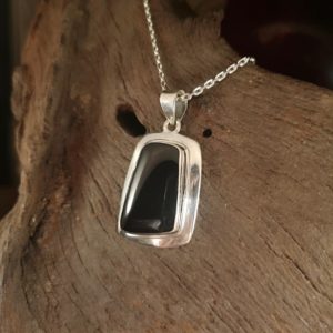 Large wide edged Whitby Jet pendant.