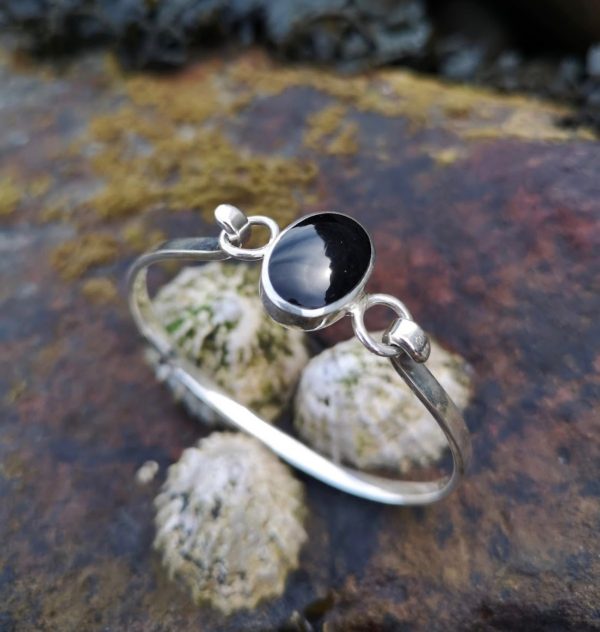 Whitby Jet Bangle set in an oval sterling silver setting