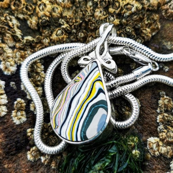Fordite pendant with Whitby Jet on reverse