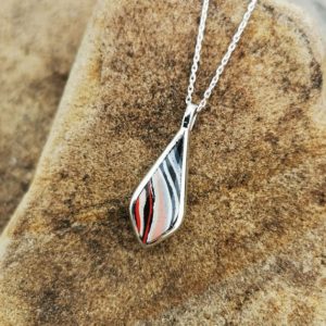 Fordite and Whitby Jet double sided drop pendant