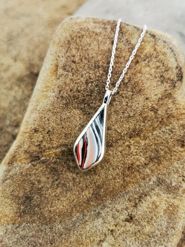 Fordite and Whitby Jet double sided drop pendant