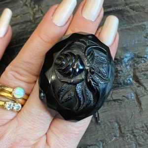 Antique Victorian Whitby Jet Brooch with carved rose and facetted edge.